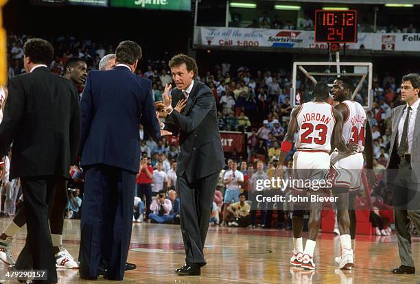 Playoffs: Chicago Bulls coach Doug Collins and Detroit Pistons coach Chuck Daly after altercation between Charles Oakley and Rick Mahorn at Chicago...