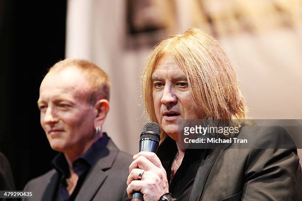 Phil Collen and Joe Elliott of Def Leppard speak onstage during the KISS and Def Leppard announcment of their 2014 Summer tour held at The House of...
