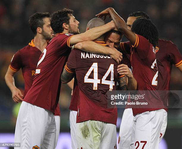 Francesco Totti with his teammates of AS Roma celebrates after scoring the opening goal during the Serie A match between AS Roma and Udinese Calcio...