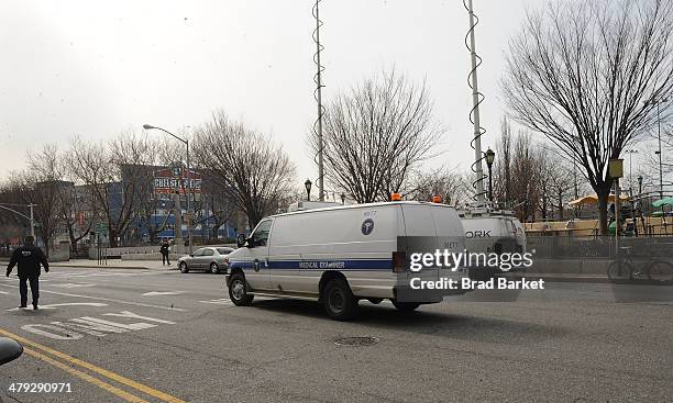 Medical examiners van leaves The scene outside the Chelsea apartment building on March 17, 2014 in New York City, where fashion designer L'Wren Scott...