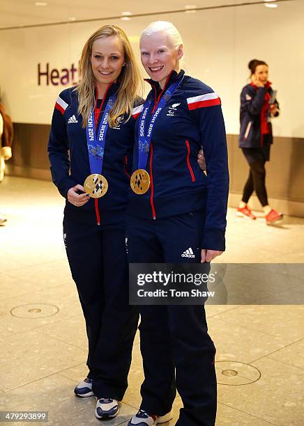 Charlotte Evans and Kelly Gallacher of Great Britain show off their Gold medal during the ParalympicsGB Welcome Home Press Conference at Heathrow...