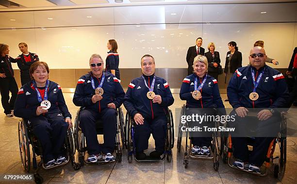 ParalympicsGB curlers Aileen Neilson, Jim Gault, Bob McPherson, Angie Malone and Gregor Ewan show off their medals during the ParalympicsGB Welcome...