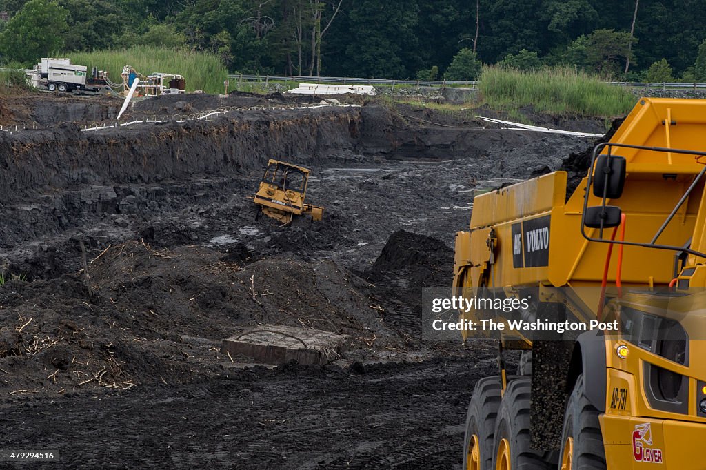 DUMFRIES, VA - JUNE 26:    Heavy machinery excavate  and carry 