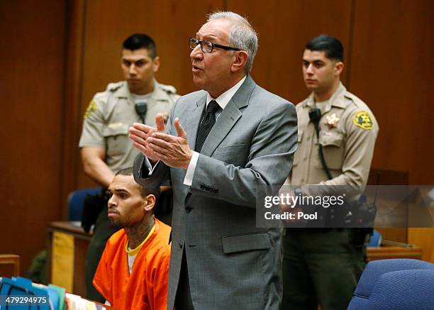 Singer Chris Brown appears in court with his attorney Mark Geragos for a probation violation hearing during which his probation was revoked by a Los...