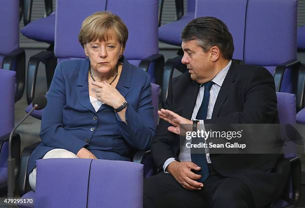 German Chancellor Angela Merkel and Vice Chancellor and Economy and Energy Minister Sigmar Gabriel attend a session of the Bundestag on July 3, 2015...