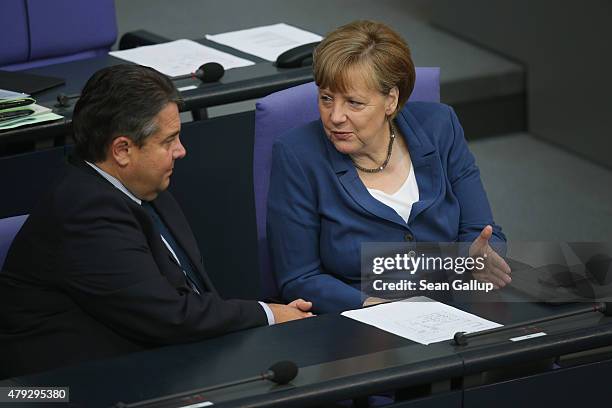 German Chancellor Angela Merkel and Vice Chancellor and Economy and Energy Minister Sigmar Gabriel attend a session of the Bundestag on July 3, 2015...