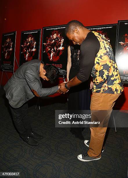 Actor Iko Uwais and professional kickboxer Wayne Barrett attend "The Raid 2" special screening at Sunshine Landmark on March 17, 2014 in New York...