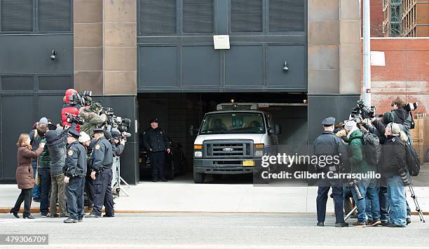 The Medical Examiner's van is seen leaving the scene of the Chelsea apartment building on March 17, 2014 in New York City, where fashion designer...