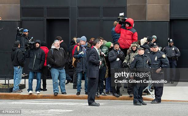 General view of media and NYPD officers are seen at the scene outside 200, 11th Avenue, the Chelsea apartment building on March 17, 2014 in New York...