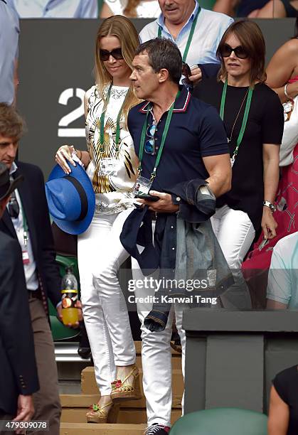 Nicole Kempel and Antonio Banderas attend the Dustin Brown v Rafael Nadal match on day four of the Wimbledon Tennis Championships at Wimbledon on...