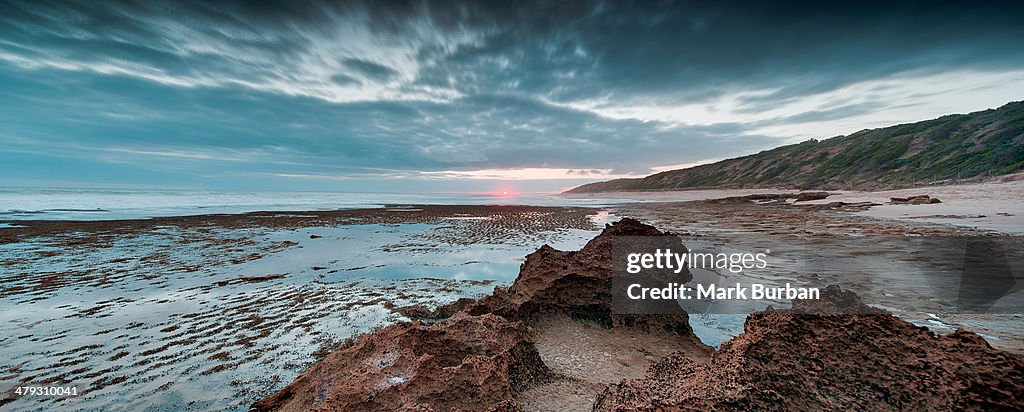 The last rays of sunset on a winter beach