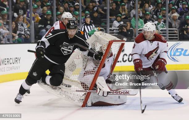 Jeff Carter of the Los Angeles Kings knocks the net over onto Mike Smith of the Phoenix Coyotes during the second period at the Staples Center on...