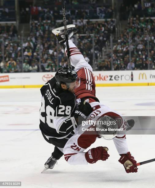 Michael Stone of the Phoenix Coyotes and Jarret Stoll of the Los Angeles Kings get tangled up during the second period at the Staples Center on March...