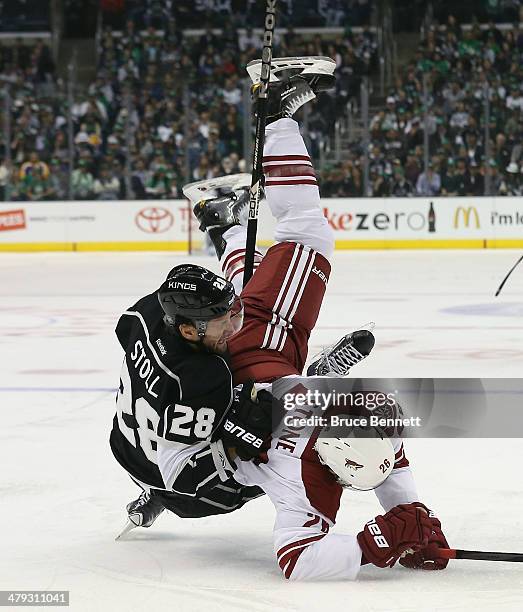 Michael Stone of the Phoenix Coyotes and Jarret Stoll of the Los Angeles Kings get tangled up during the second period at the Staples Center on March...