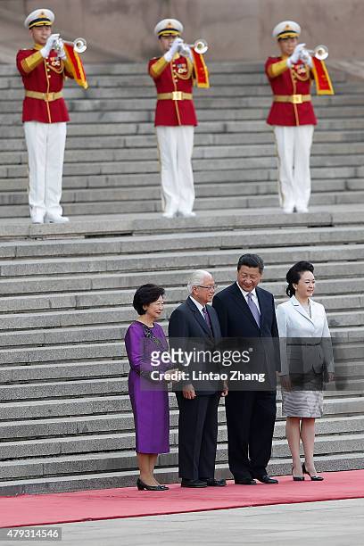 Singaporean President Tony Tan Keng Yam and his wife Mary Tan with Chinese President Xi Jinping and his wife lady Peng Liyuan attend a welcoming...