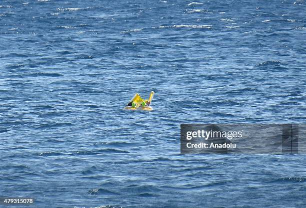 Month-old baby Melda Ilgin is seen as she drifts a kilometer out to sea on a sea buoy in Ayvacik district of Canakkale province, Turkey on July 3,...