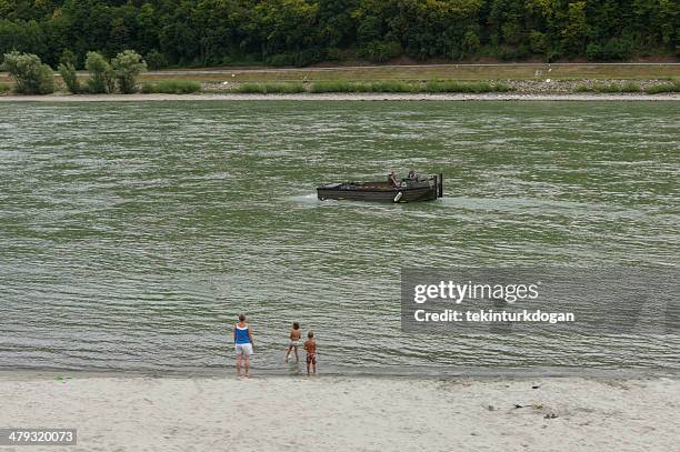 boat and family by danube river austria - venus willendorf stock pictures, royalty-free photos & images