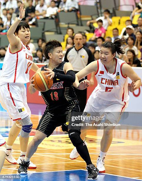 Yuko Oga of Japan in action during the FIBA Aisa Championship for Women Level I match between Japan and China at Seahat Omura on August 27, 2011 in...