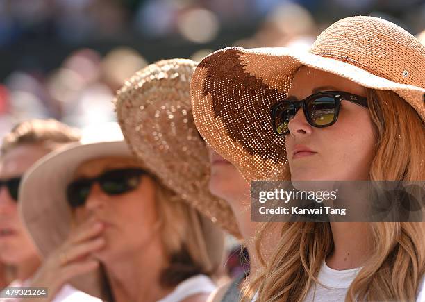 Tennis fans enjoy the action at the Grigor Dimitrov v Richard Gasquet match on day five of the annual Wimbledon Tennis Championships at Wimbledon on...