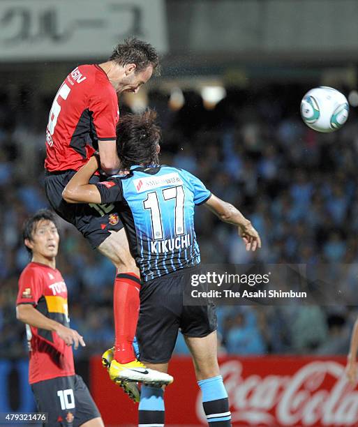 Joshua Kennedy of Nagoya grampus scores his team's second goal during the J.League match between Kawasaki Frontale and Nagoya Grampus at Todoroki...