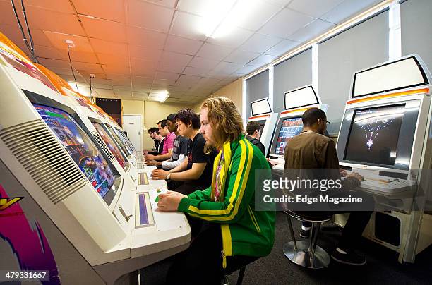 Group of customers playing games inside The Heart Of Gaming video game arcade in London, on May 8, 2013.