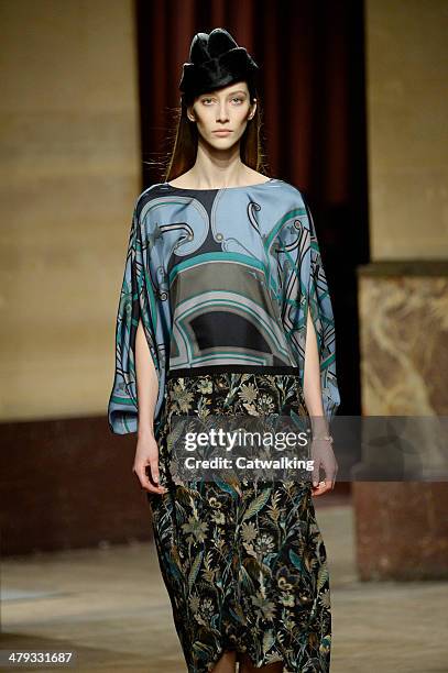 Model walks the runway at the Hermes Autumn Winter 2014 fashion show during Paris Fashion Week on March 5, 2014 in Paris, France.