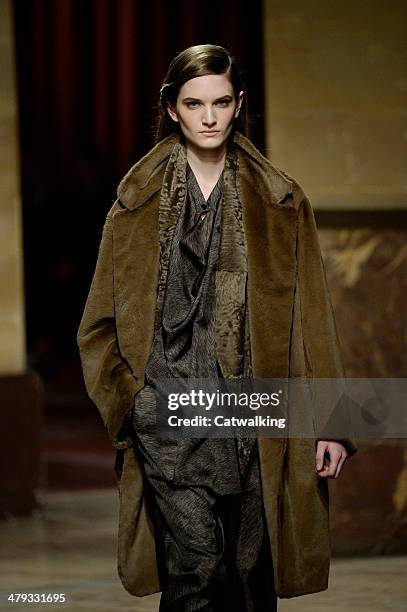 Model walks the runway at the Hermes Autumn Winter 2014 fashion show during Paris Fashion Week on March 5, 2014 in Paris, France.