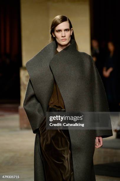 Model walks the runway at the Hermes Autumn Winter 2014 fashion show during Paris Fashion Week on March 5, 2014 in Paris, France.