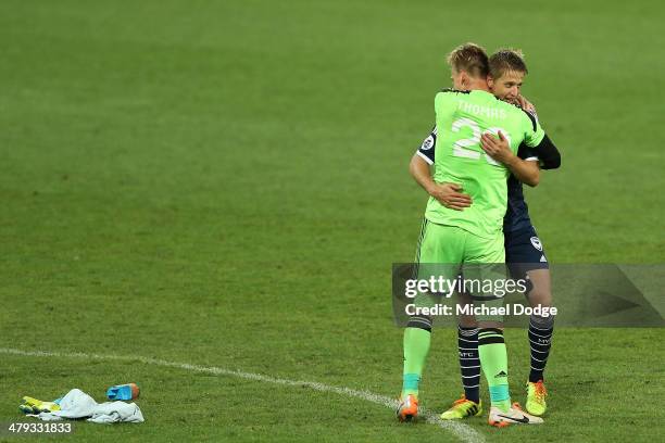 Goalkeeper Lawrence Thomas and Adrian Leijer of the Victory celebrate their victory during the AFC Asian Champions League match between the Melbourne...