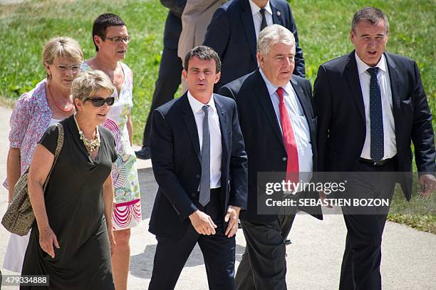 French Prime minister Manuel Valls walks with President of Franche-Comte region Marie-Guite Dufay , President of the Doubs department Christine...