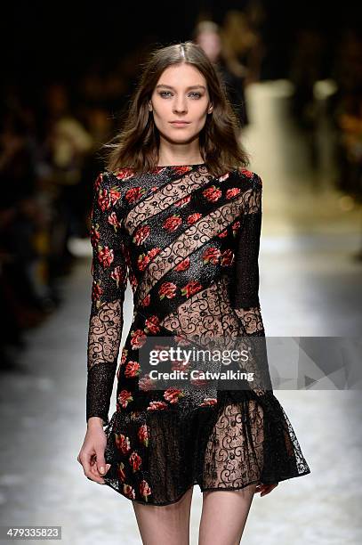 Model walks the runway at the Blumarine Autumn Winter 2014 fashion show during Milan Fashion Week on February 21, 2014 in Milan, Italy.