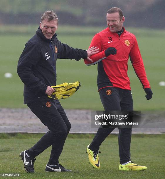 Manager David Moyes and Wayne Rooney of Manchester United in action during a first team training session, ahead of their UEFA Champions League Round...