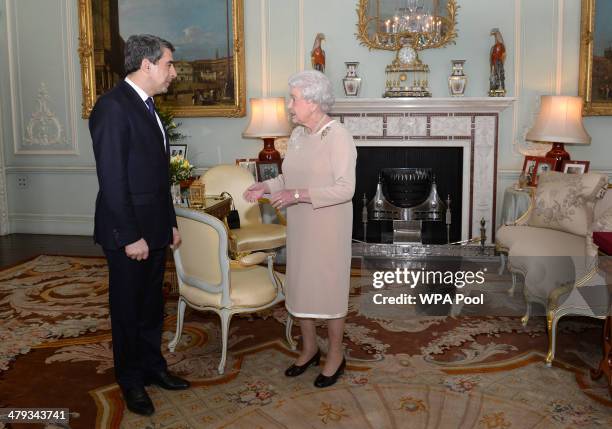 Queen Elizabeth II welcomes President of the Bulgarian Republic, Rosen Plevneliev during a private audience at Buckingham Palace on March 18, 2014 in...