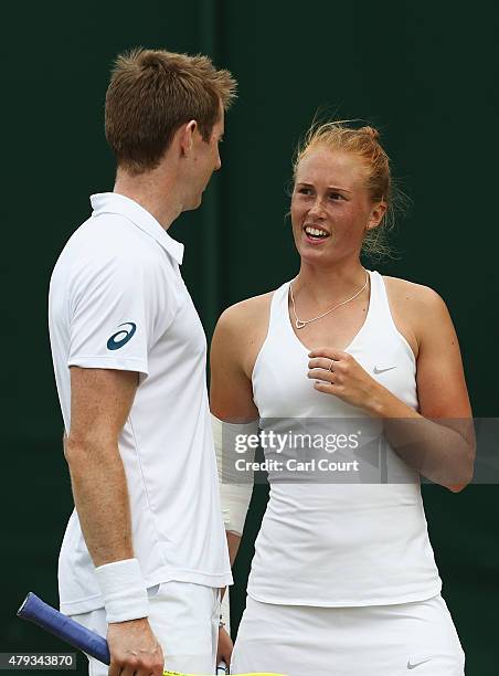 Jonathan Marray of Great Britain and Anna Smith of Great Britain talk tactics in their Mixed Doubles First Round match against Artem Sitak of New...