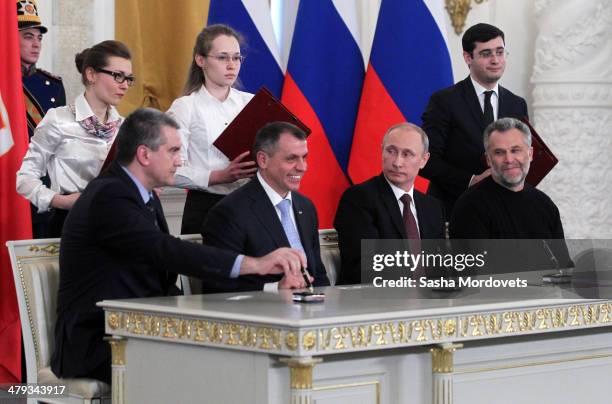 Crimea Prime Minister Sergei Aksyonov, Chairman of the Crimea State Council Vladimir Konstantinov, Russian President Vladimir Putin and Mayor of...