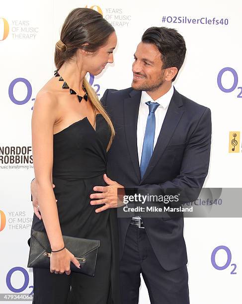 Emily MacDonagh and Peter Andre attend at the Nordoff Robbins O2 Silver Clef Awards at The Grosvenor House Hotel on July 3, 2015 in London, England.