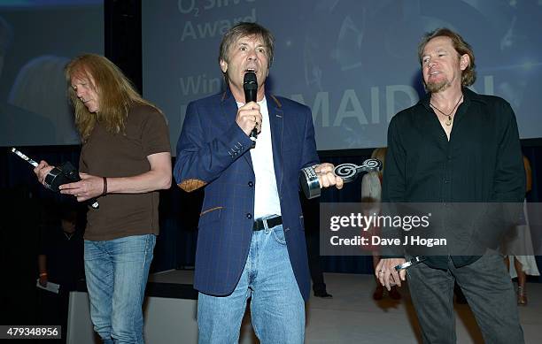 Janick Gers, Bruce Dickerson and Adrian Smith from Iron Maiden with their O2 Silver Clef award at the Nordoff Robbins O2 Silver Clef awards at the...