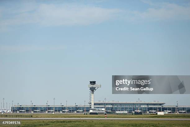 The new and unfinished BER Willy Brandt Berlin Brandenburg International Airport, including the control tower, stand on July 3, 2015 in Schoenefeld,...