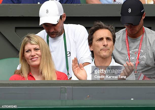 Meredith Ostrom and Lawrence Bender attend the Novak Djokovic v Bernard Tomic match on day five of the annual Wimbledon Tennis Championships at...