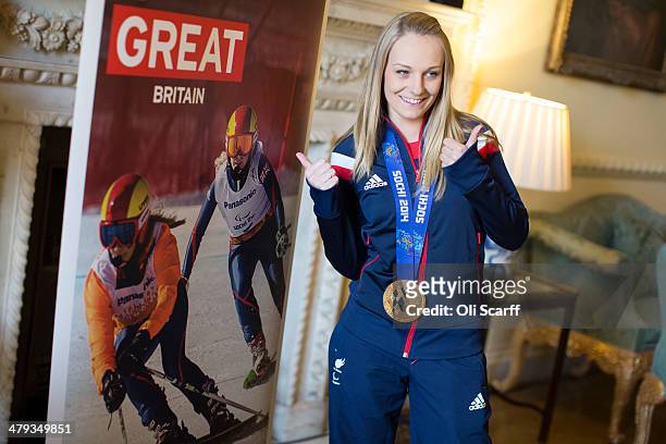 Gold medal winning skier Charlotte Evans, a member of the Winter Paralympic Team GB, poses for a photo in Downing Street upon the team's return from...