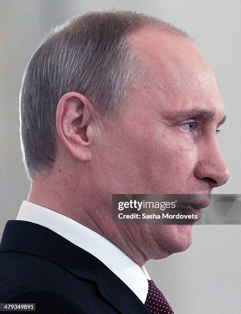 Russian President Vladimir Putin makes a speech during a signing ceremony at the Grand Kremlin Palace on March 18, 2014 in Moscow, Russia. President...