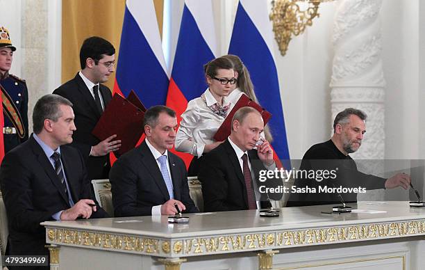 Crimea Prime Minister Sergei Aksyonov, Chairman of the Crimea State Council Vladimir Konstantinov, Russian President Vladimir Putin and Mayor of...