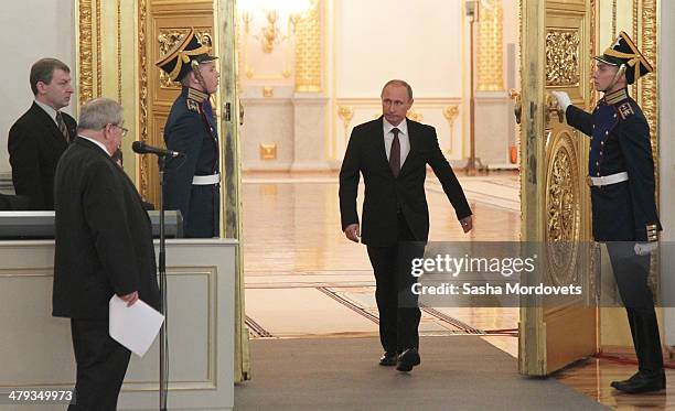 Russian President Vladimir Putin arrives during a signing ceremony at the Grand Kremlin Palace on March 18, 2014 in Moscow, Russia. President Putin...