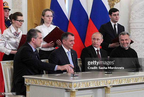 Crimea Prime Minister Sergei Aksyonov, Chairman of the Crimea State Council Vladimir Konstantinov, Russian President Vladimir Putin and Mayor of...
