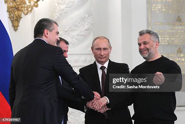 Crimea Prime Minister Sergei Aksyonov, Chairman of the Crimea State Council Vladimir Konstantinov, Russian President Vladimir Putin and Mayor of...