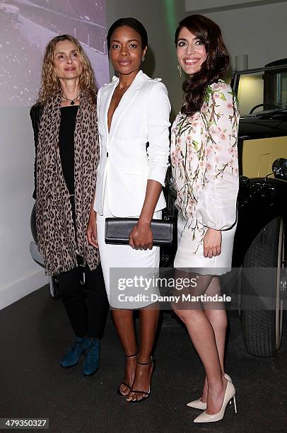 Bond Girls Maryam d'Abo, Naomie Harris and Caterina Murino attends a photocall ahead of the opening of the Bond In Motion exhibition at the London...