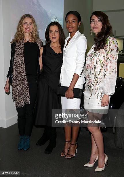 Maryam d'Abo, Barbara Broccoli, Naomie Harris and Caterina Murino attends a photocall ahead of the opening of the Bond In Motion exhibition at the...
