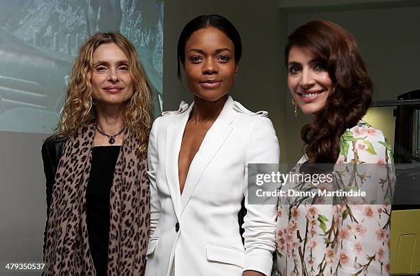 Bond Girls Maryam d'Abo, Naomie Harris and Caterina Murino attends a photocall ahead of the opening of the Bond In Motion exhibition at the London...