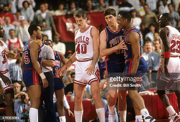 Playoffs: Detroit Pistons Rick Mahorn with Bill Laimbeer during confrontation vs Chicago Bulls Charles Oakley at Chicago Stadium. Game 3. Chicago, IL...