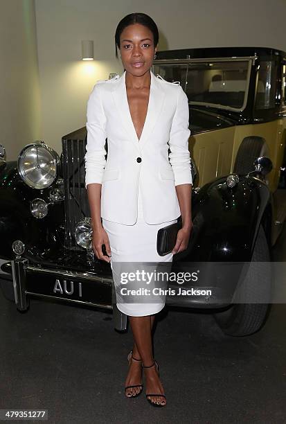 Actress Naomie Harris poses in front of the Rolls Royce Phantom III from Goldfinger as he attends a drinks reception ahead of the opening of the Bond...